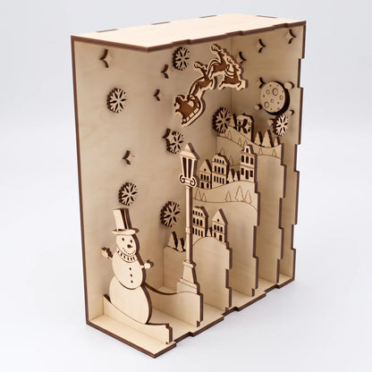 Left perspective view of open layered laser cut plywood book nook diorama displaying tiered village panels