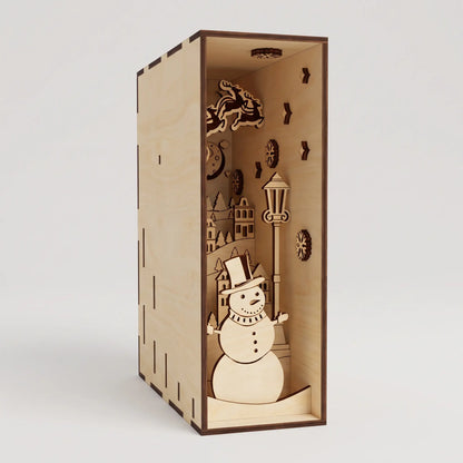 Three-quarter angle view of assembled unlit laser cut plywood Christmas book nook insert on plain white backdrop