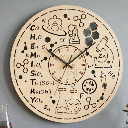 Laser cut plywood chemistry wall clock hanging on a gray wall, featuring engraved science formulas and cut out design