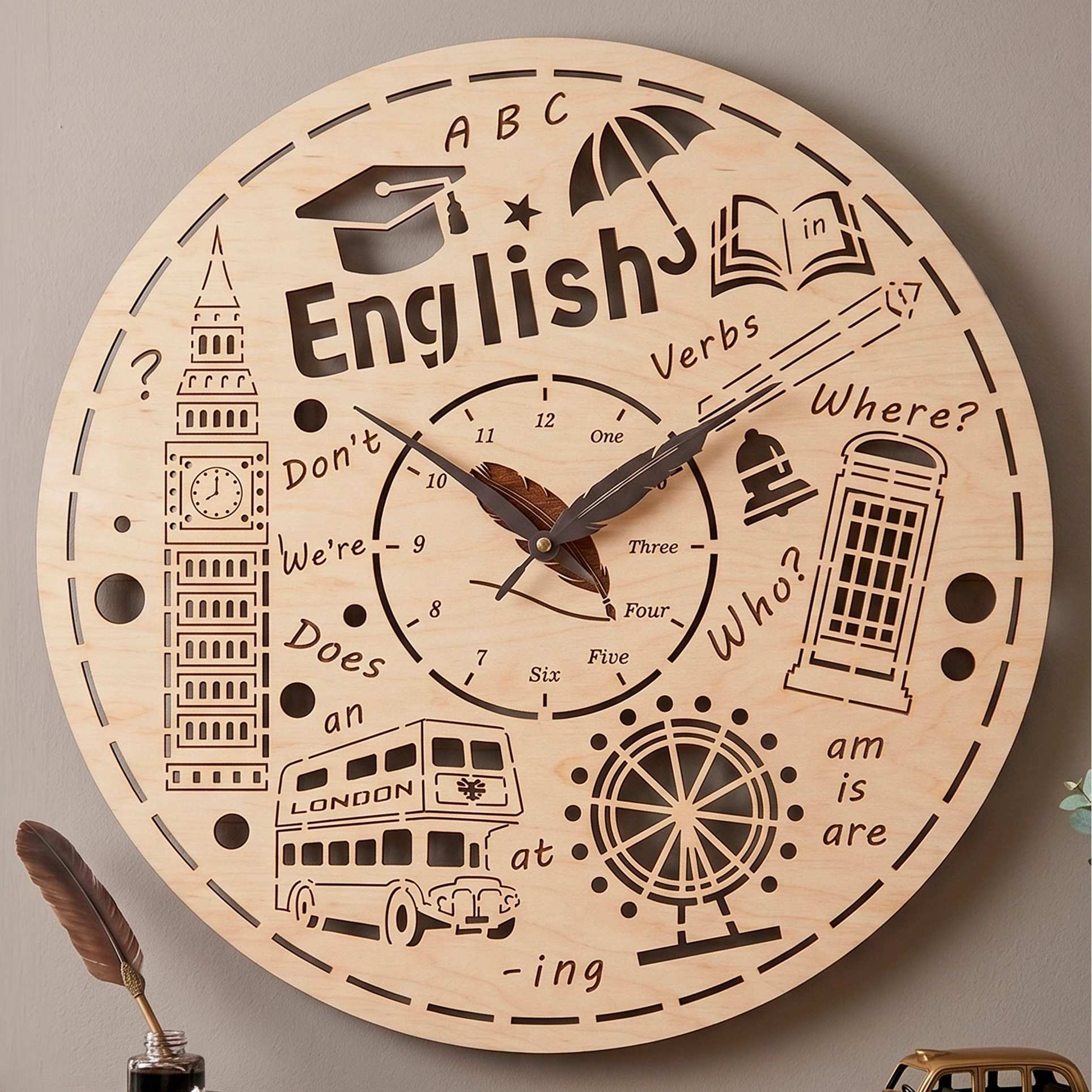 Laser cut plywood English theme wall clock with engraved London symbols, words and a feather quill hands detail.