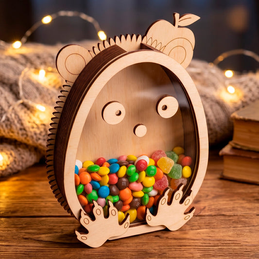Laser cut plywood hedgehog shaped candy box with an acrylic window filled with colorful sweets on a cozy lights background.