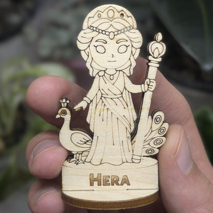 Hand holds a laser cut plywood Hera for scale. Detailed front showing the engraved crown, scepter, and royal Greek robes