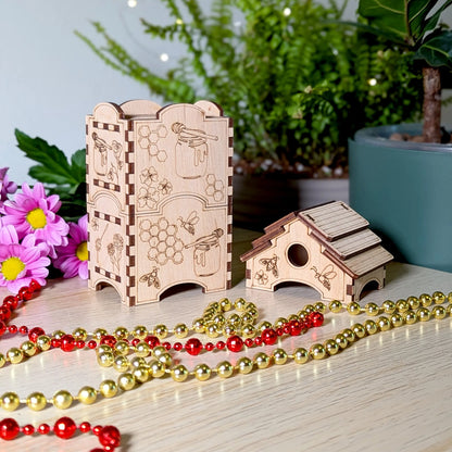 Disassembled laser cut plywood beehive tea box showing the modular body container next to its removable roof lid.