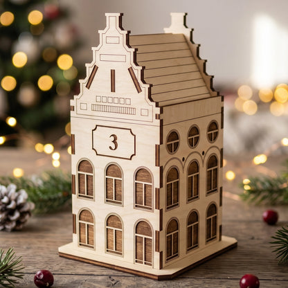 Miniature laser cut plywood town house gift box with a stepped gable roof and number three on a rustic wooden table.