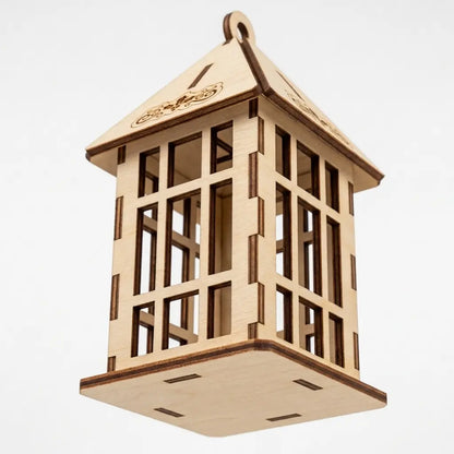 Low-angle perspective view of assembled laser cut plywood lantern ornament with slatted grille on white