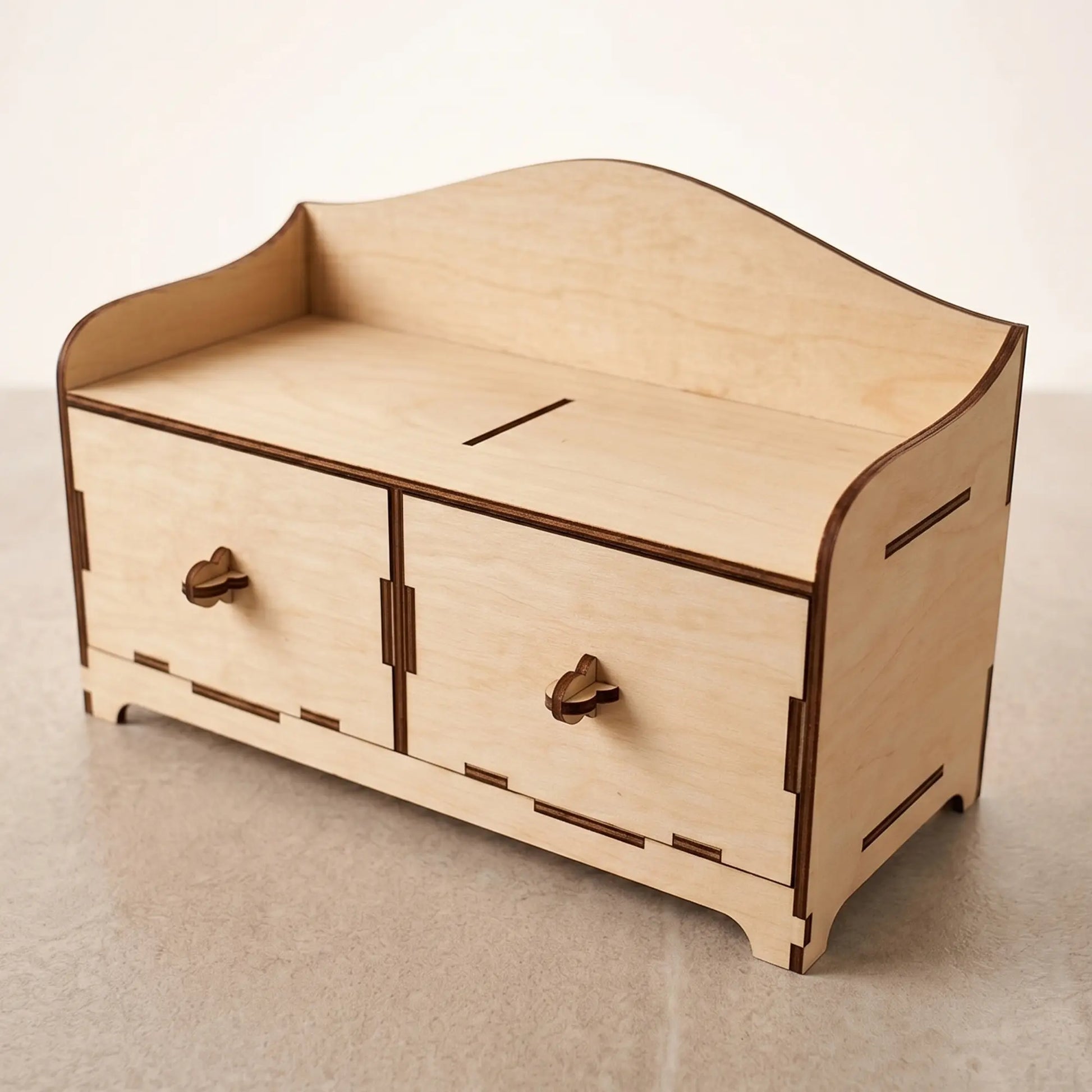 Empty wooden desktop mini-chest with two drawers, crafted from laser cut plywood and staged on a light background.