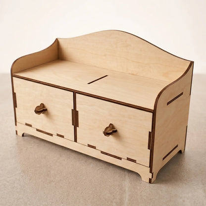 Empty wooden desktop mini-chest with two drawers, crafted from laser cut plywood and staged on a light background.