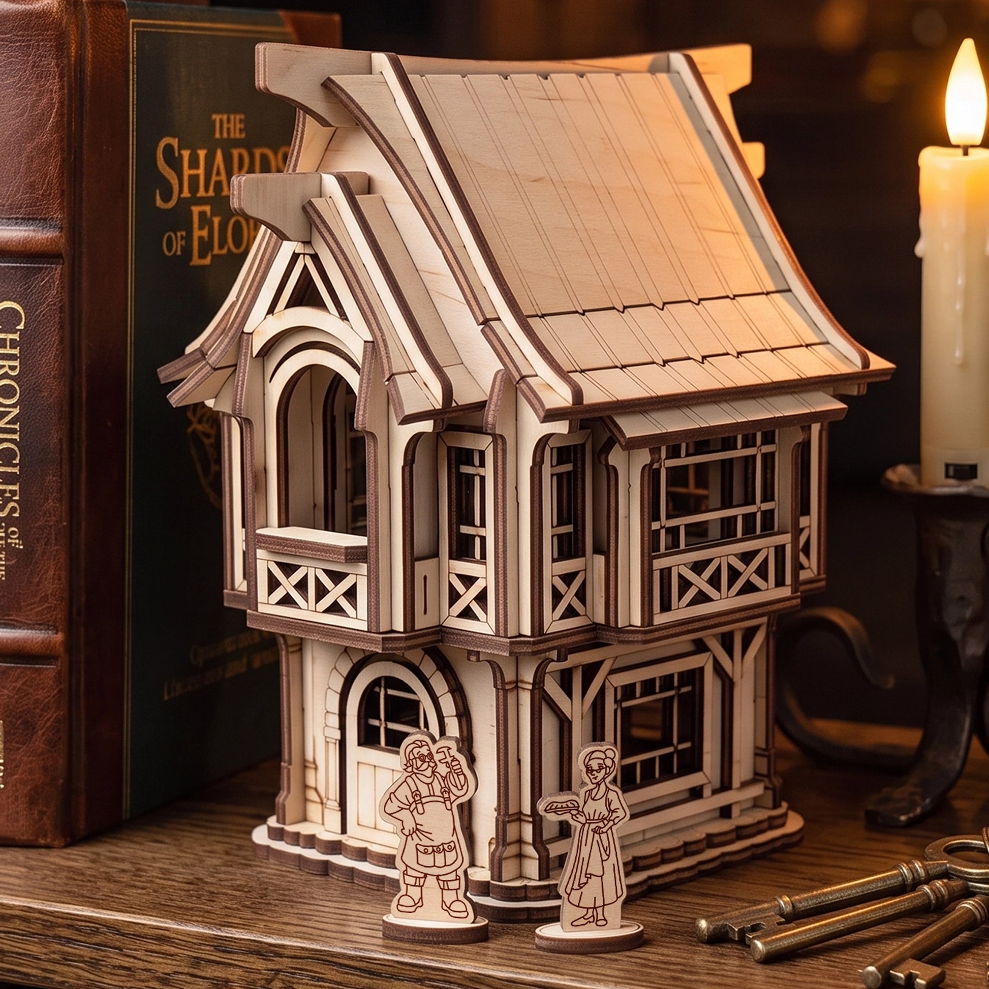 Medieval village house made of laser cut plywood displayed on a bookshelf next to fantasy novels