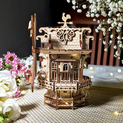 A lovely straight side profile of an intricate 3D holiday windmill with warm lighting, beautifully made of laser cut plywood.