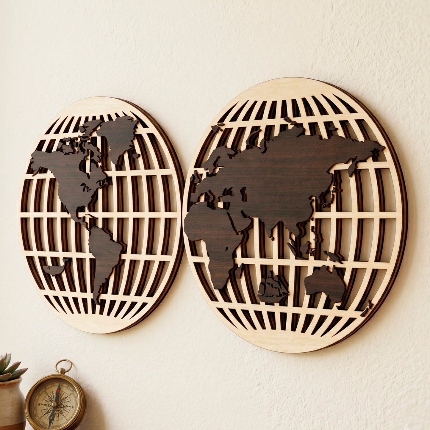 Laser cut plywood hemisphere map wall decor showing 3D layered edges on a wall above a wooden desk with a brass compass.