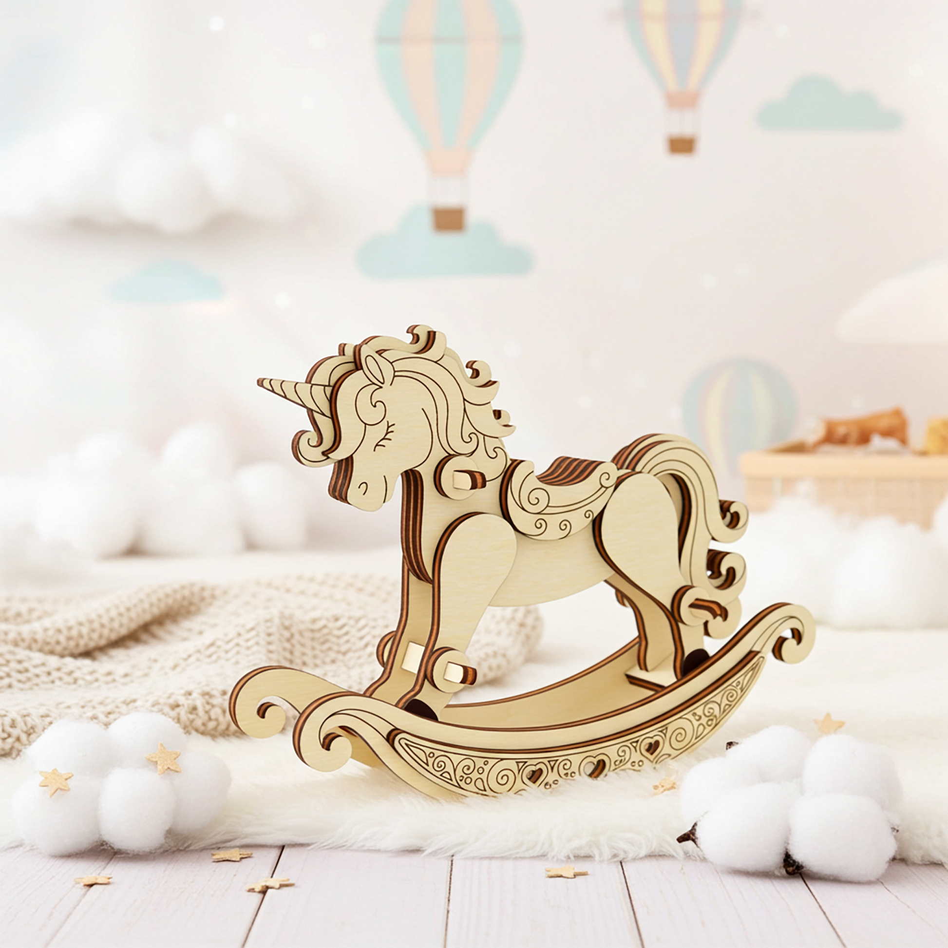 Cute wooden rocking unicorn toy created with laser cutting shown in a soft baby-room scene with clouds and stars