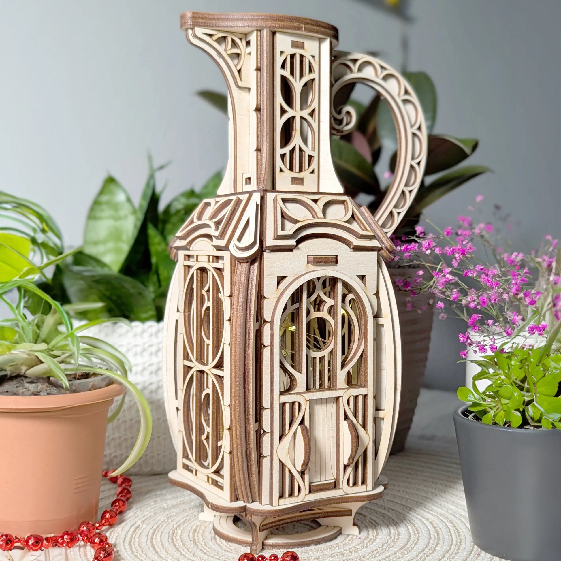 Detailed close-up shot showing the arched door and multi-layer wood textures of a laser cut plywood jug miniature house.