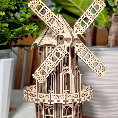 Detailed view of an assembled laser cut plywood Victorian windmill highlighting its ornate balconies and arched windows.