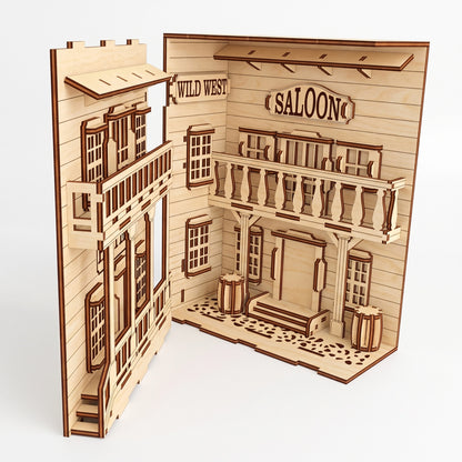 Open-view of a laser-cut birch plywood Wild West saloon book nook showing a balcony, saloon sign, and dark burnt edges.