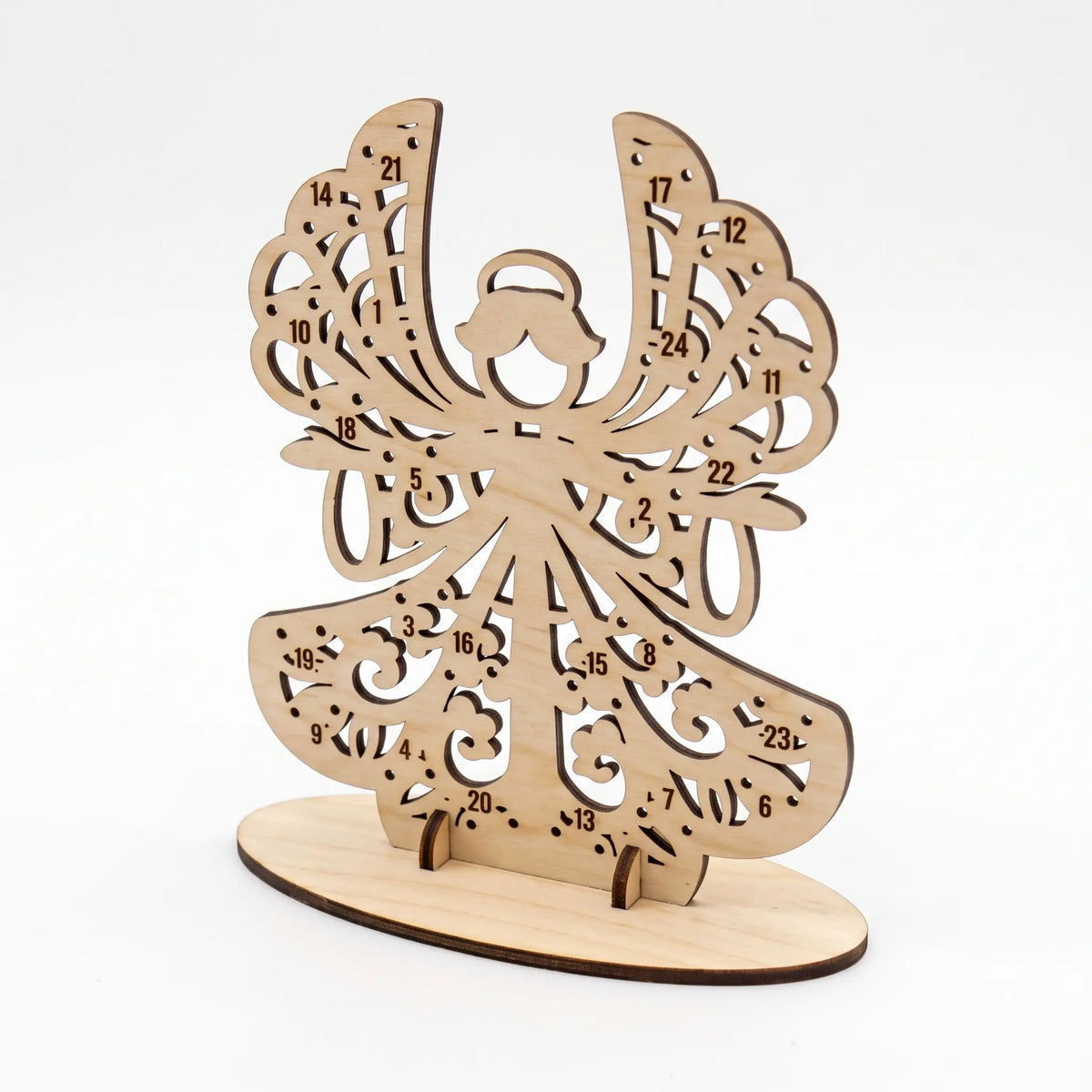 Angled view of empty laser cut plywood angel advent calendar slotted into oval base stand on white background.