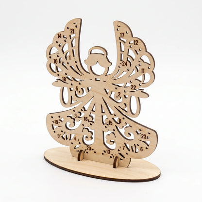 Angled view of empty laser cut plywood angel advent calendar slotted into oval base stand on white background.