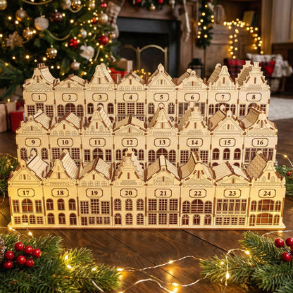 
Wooden laser cut Advent Calendar Town featuring a detailed row of 24 numbered houses with windows, doors, and festive rooftops, displayed against a softly blurred Christmas tree background.