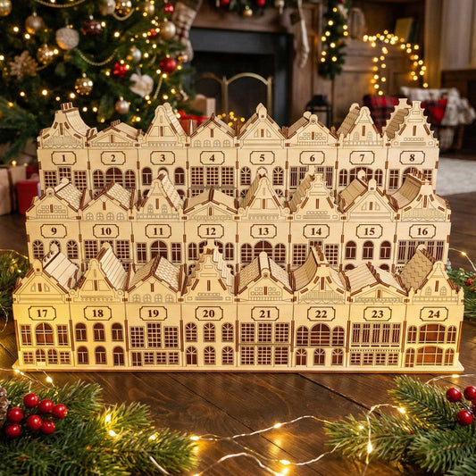 
Wooden laser cut Advent Calendar Town featuring a detailed row of 24 numbered houses with windows, doors, and festive rooftops, displayed against a softly blurred Christmas tree background.