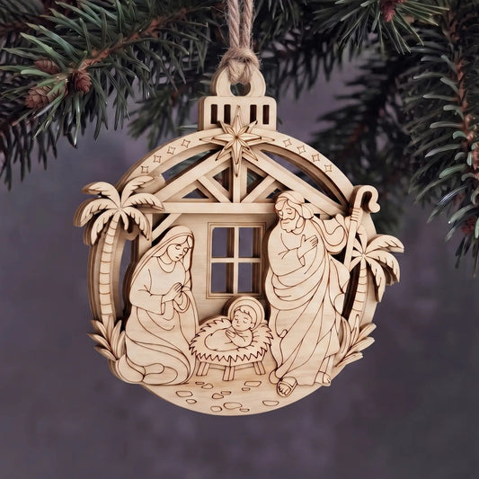 Layered laser cut plywood Holy Family nativity ornament hanging with twine rope on evergreen Christmas tree boughs