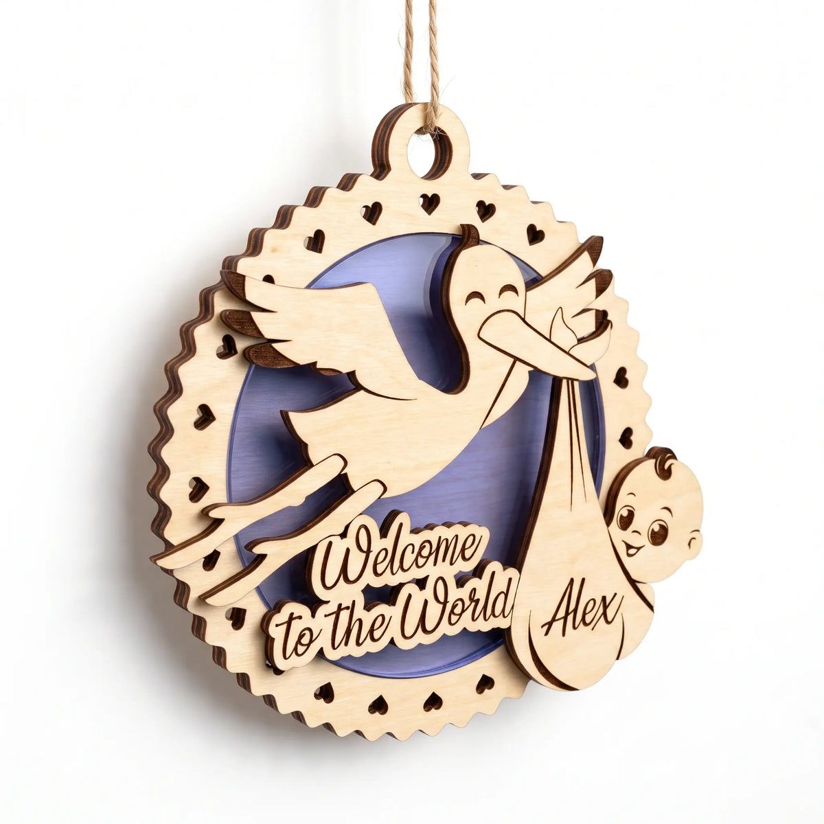 Personalized laser cut plywood baby birth ornament featuring flying stork, newborn bundle, and purple base on white backdrop.
