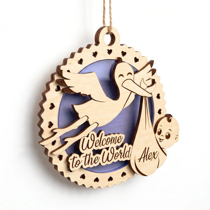 Personalized laser cut plywood baby birth ornament featuring flying stork, newborn bundle, and purple base on white backdrop.