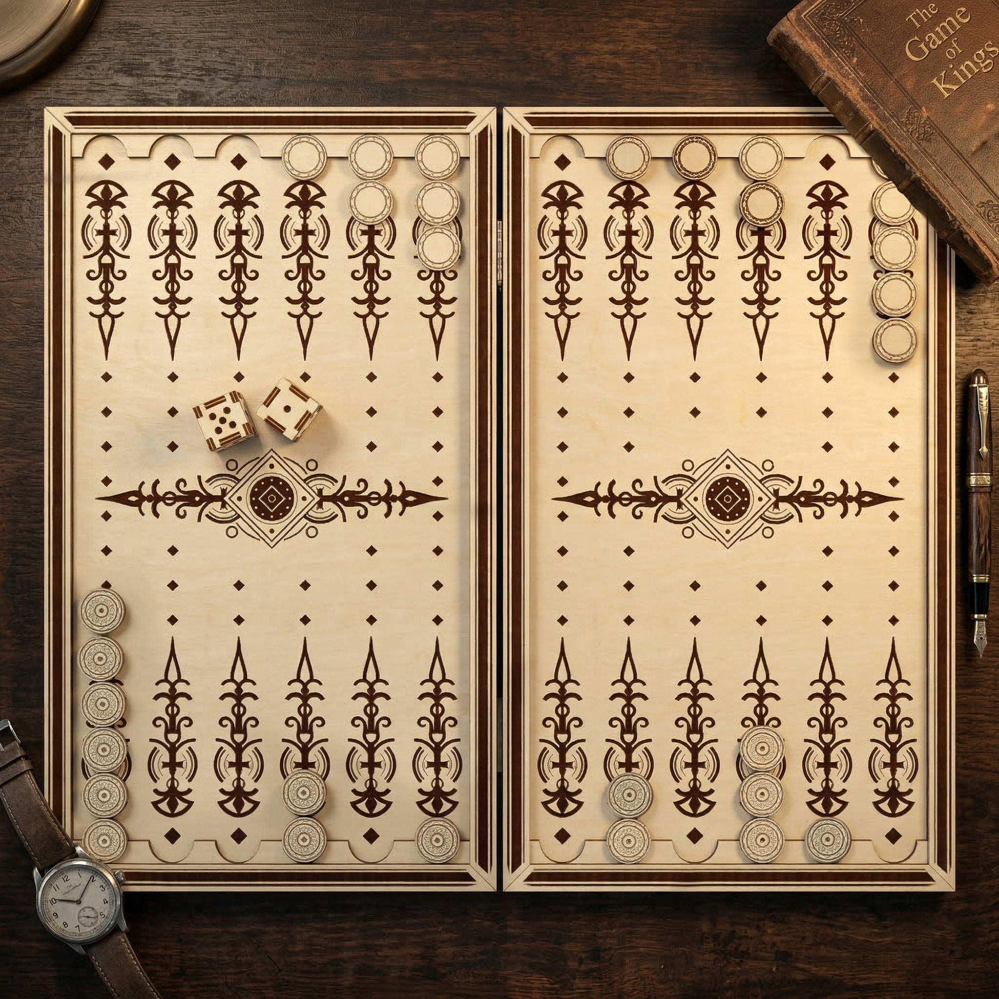 Overhead view of an open backgammon board made from laser cut plywood. Features ornate engraved points and matching circular checkers. Posed on a dark wood desk with a vintage book, fountain pen, and leather watch.