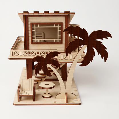 Front-facing studio view of a laser-cut birch plywood beach house model with palm trees, outdoor furniture, and stairs.
