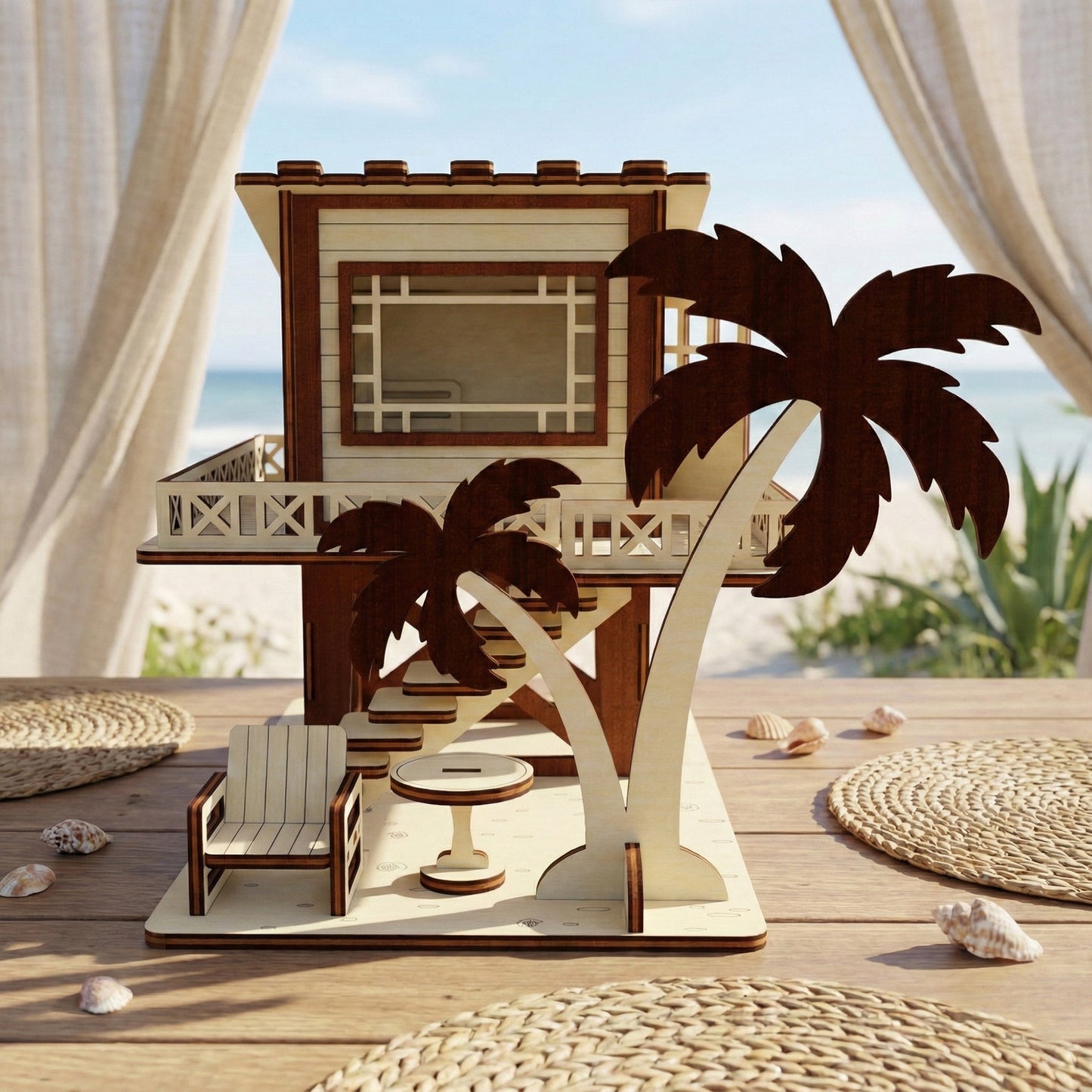 A laser cut plywood beach house showing side windows and a dark wood lifebuoy decoration. The model sits on a light wooden shelf next to beach-themed wall art and a small white bowl.