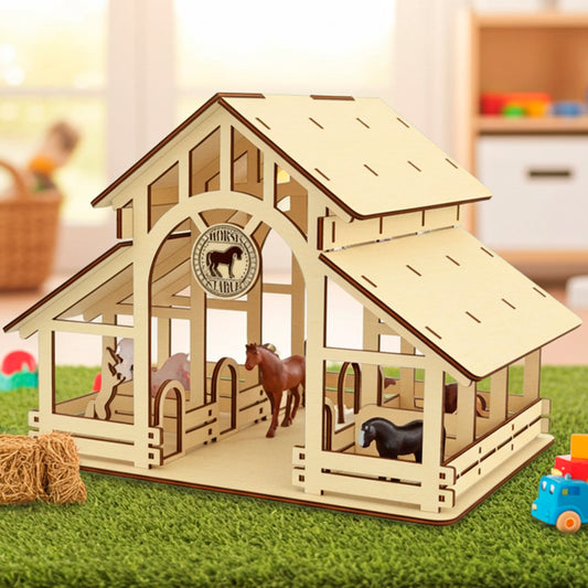 Laser cut plywood wooden two-story horse stable model with multiple stalls and a "Horses Stable" sign, placed on green turf next to toy horses, hay bale props, and a toy truck, set in a bright room