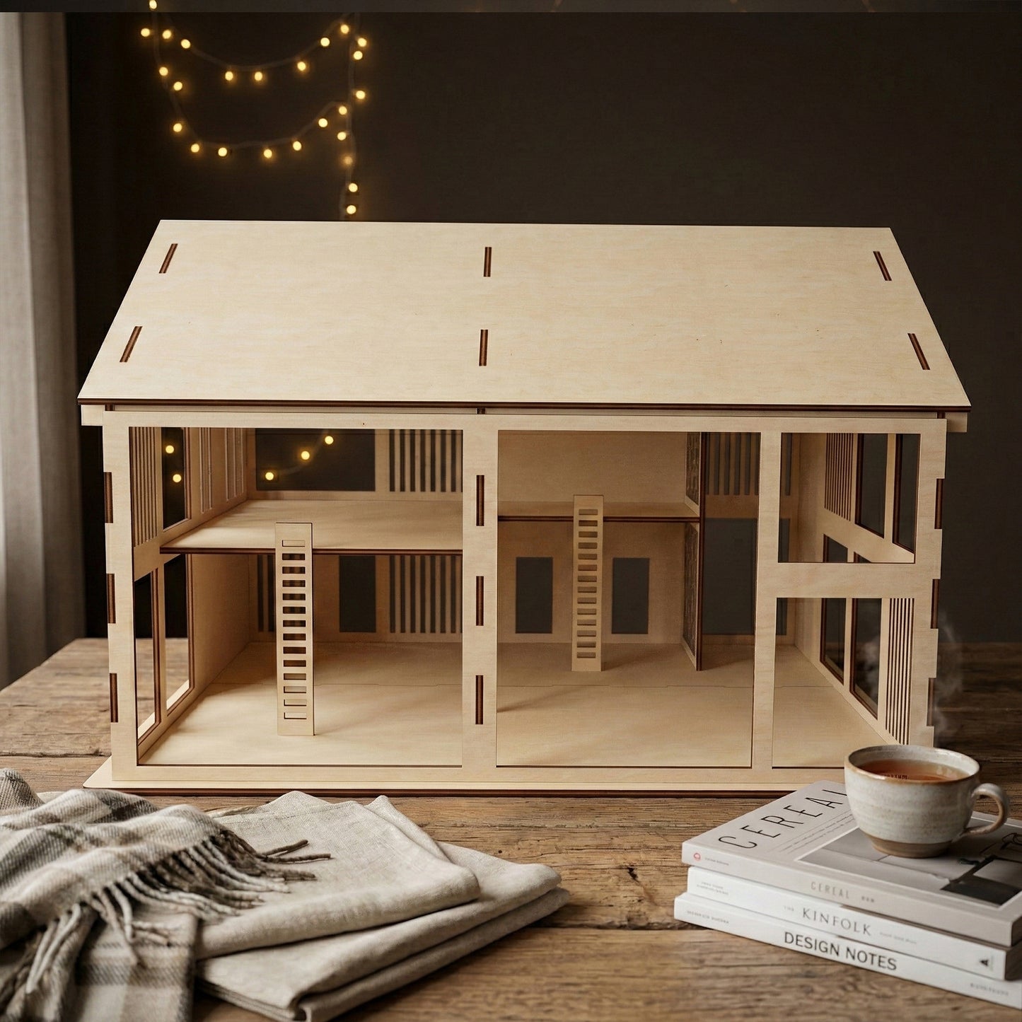 Interior view of a spacious 3D wooden dollhouse made of laser cut plywood. Features four large rooms across two floors with two minimalist ladders. The open-back design allows for easy play and customization of miniature furniture.