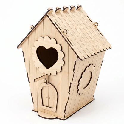 A wooden laser cut birdhouse with a heart-shaped cutout and a small door.