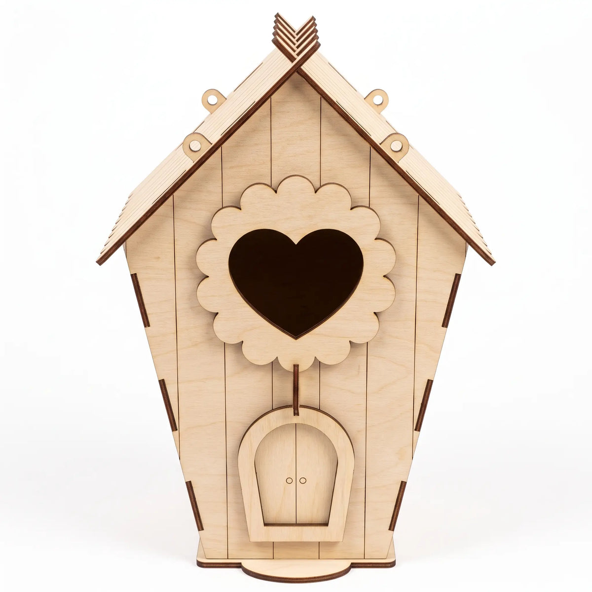 A wooden laser cut birdhouse with a heart-shaped cutout in the middle.