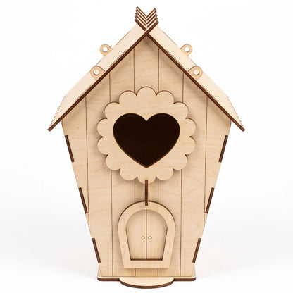 A wooden laser cut birdhouse with a heart-shaped cutout in the middle.