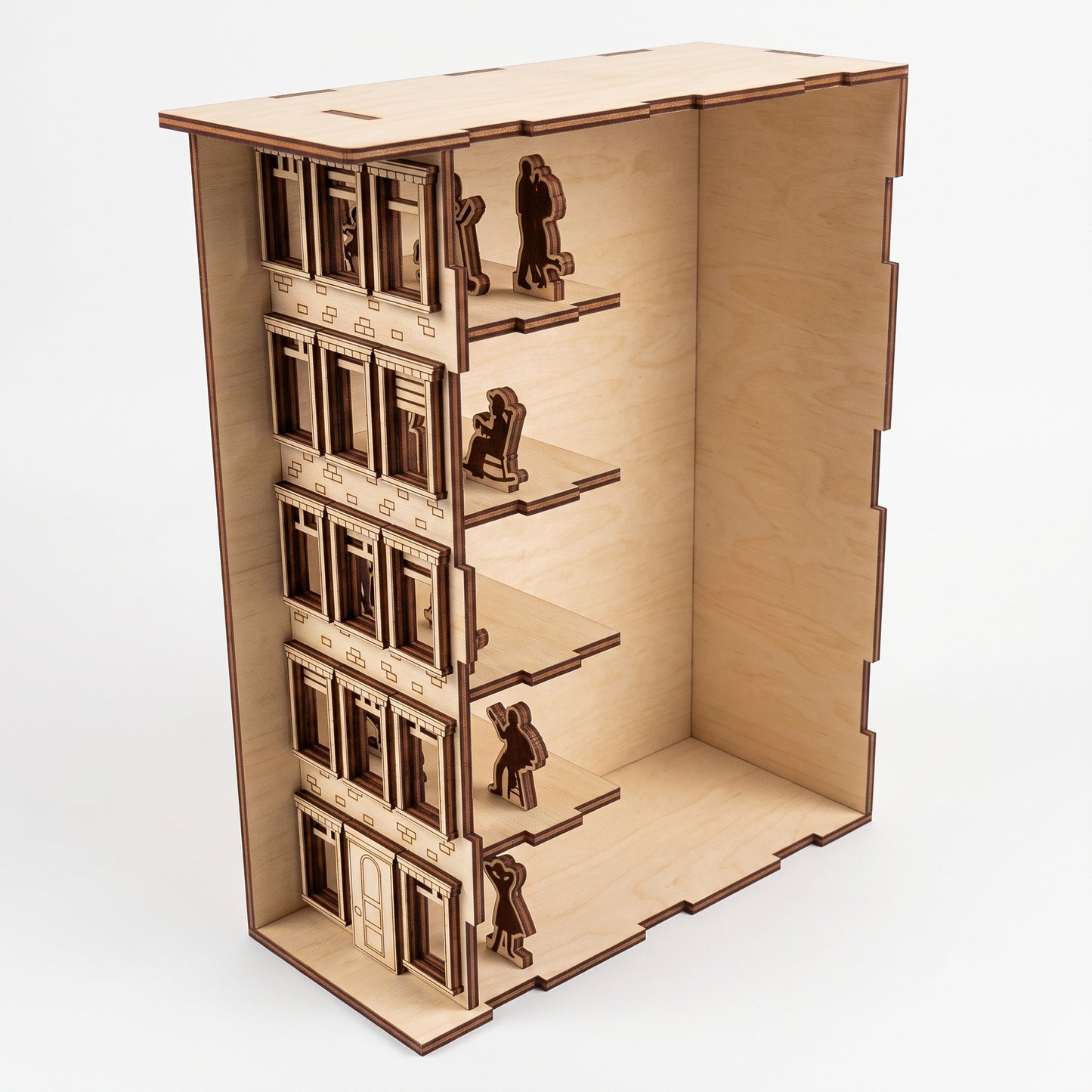 Open-view of a laser-cut birch plywood apartment house book nook showing multi-level rooms, windows, and dark burnt edges.