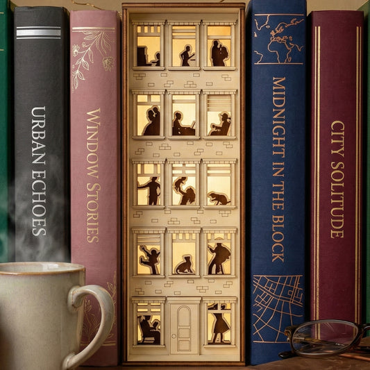 Detailed laser cut wooden Book Nook Apartment House with illuminated windows, nestled between books on a study shelf background.