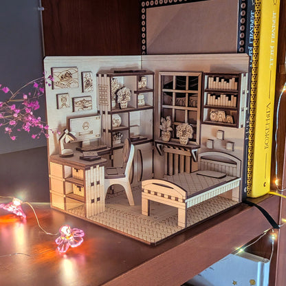 Laser cut wooden dollhouse bedroom book nook diorama with desk, bed, bookshelves and mini decor, displayed with cozy warm lights. Digital download SVG DXF AI CDR file for laser cutting