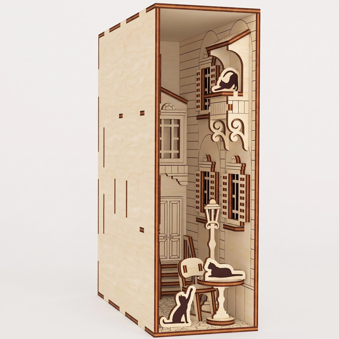 A detailed, unlit miniature French yard book nook crafted from laser cut plywood, showing its architectural depth.