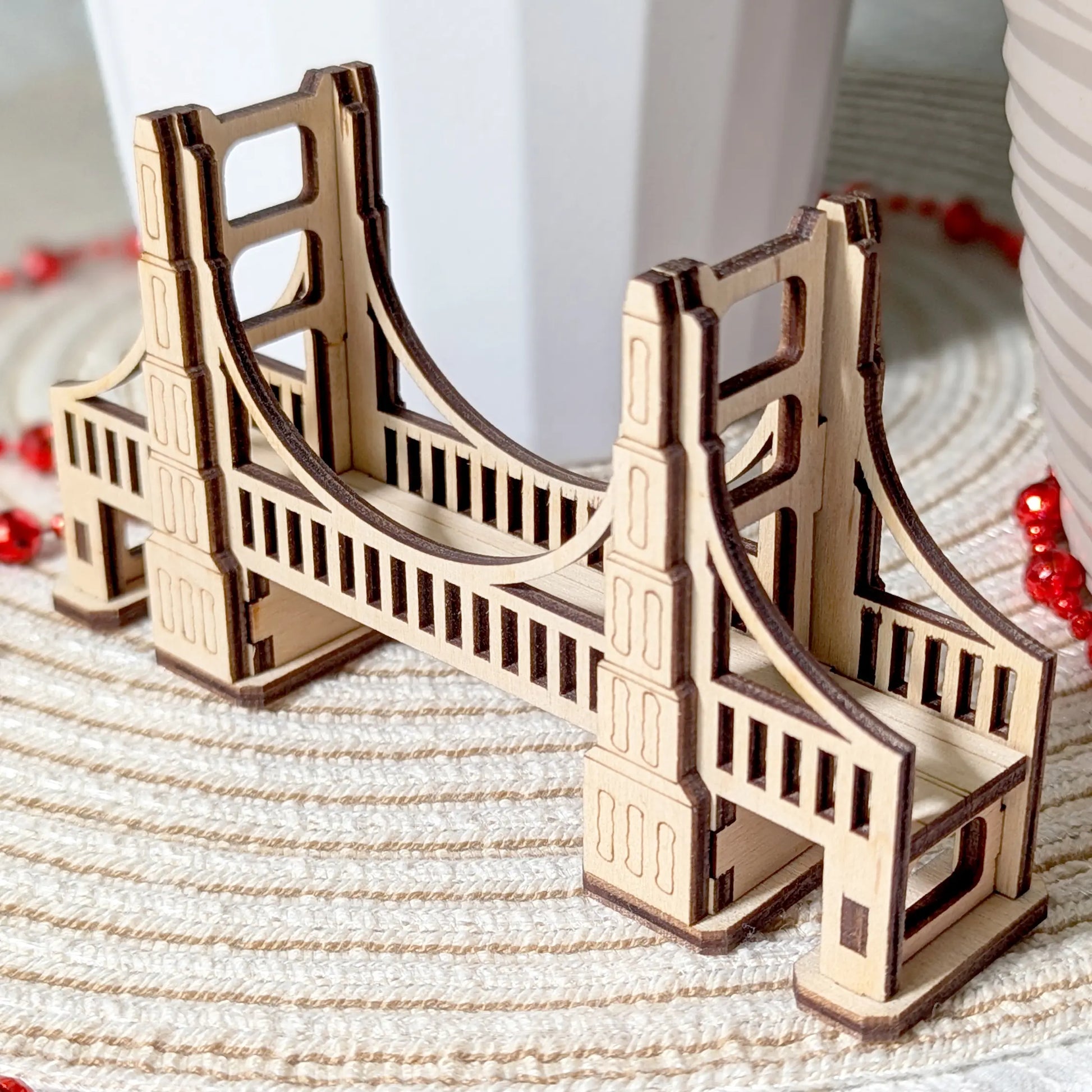 Front entrance view of a tabletop gaming bridge model of laser cut plywood. Shows the detailed archway and support pillars