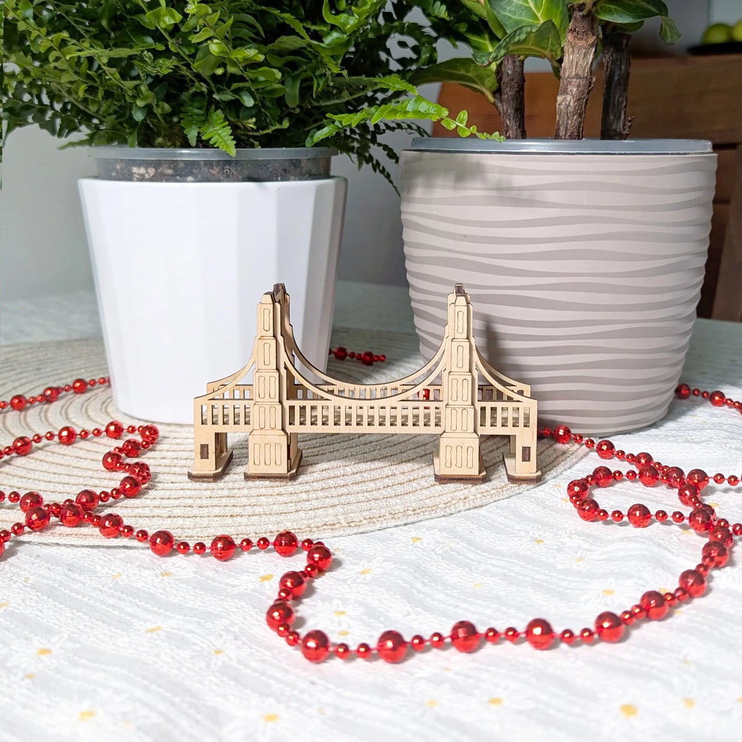 Alternative low angle shot of a decorative bridge made of laser cut plywood, highlighting structural supports underneath