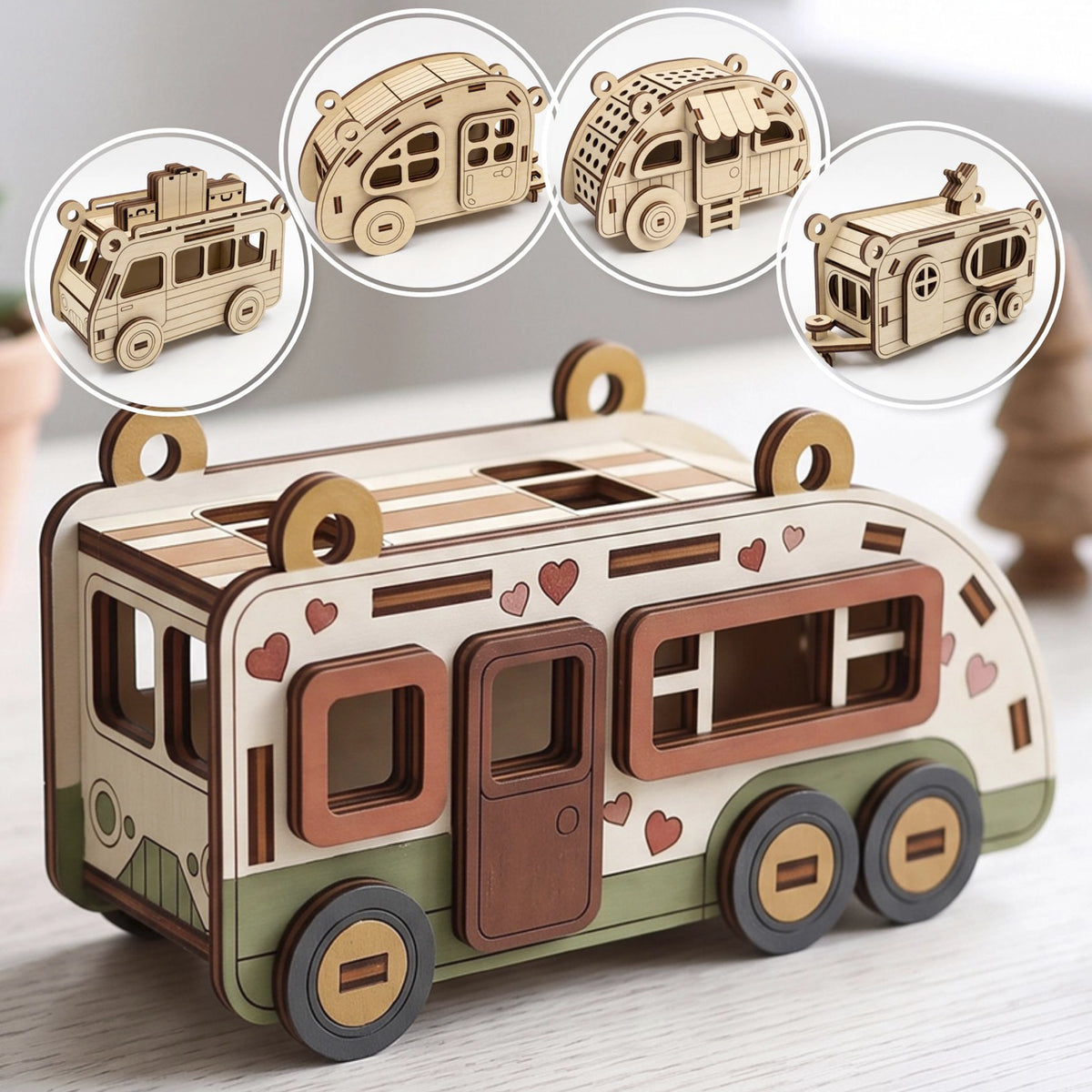 Painted laser cut plywood camper model with hearts on table with four round insets showing other wooden toy trailers.