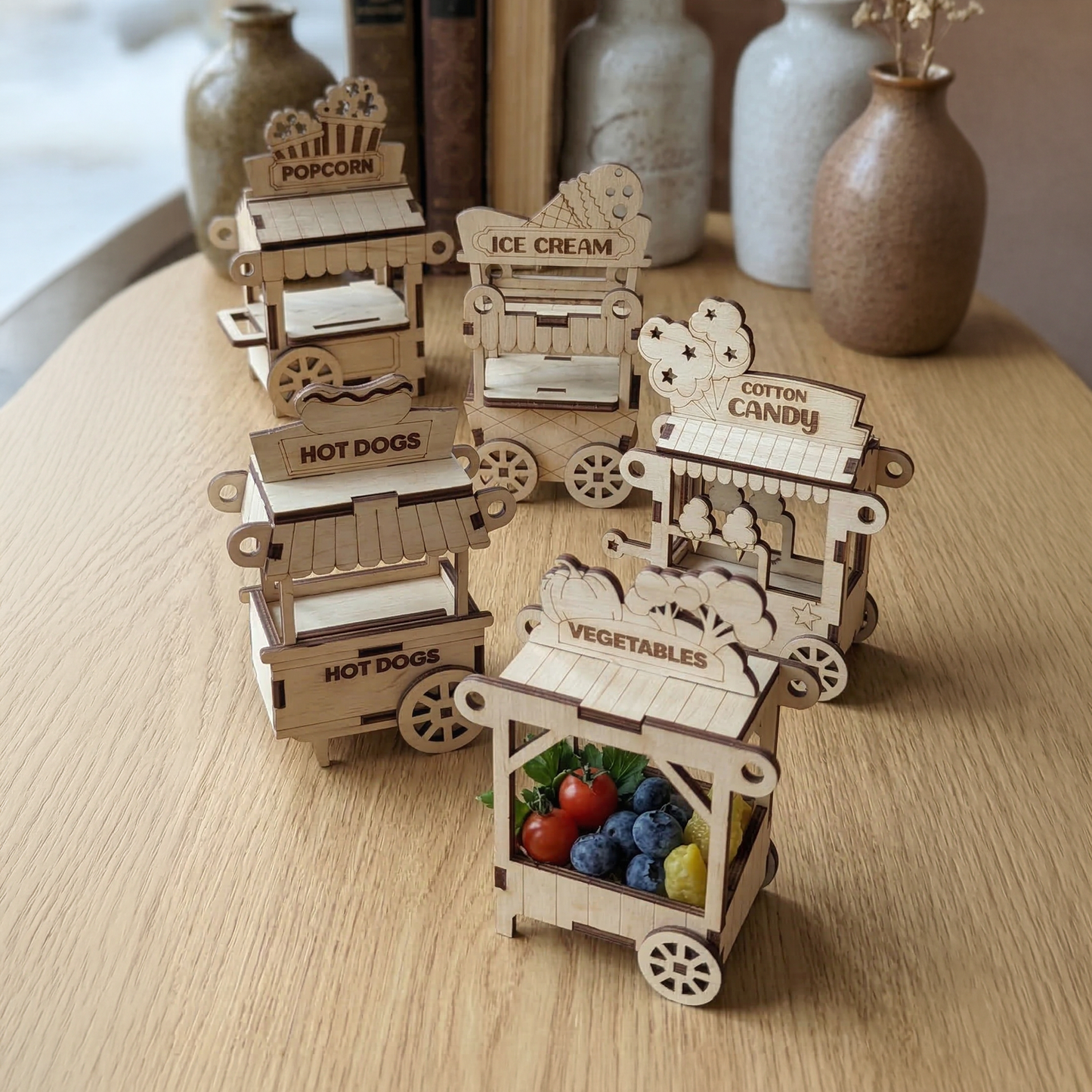 laser cut carts mominiaturs standing on table