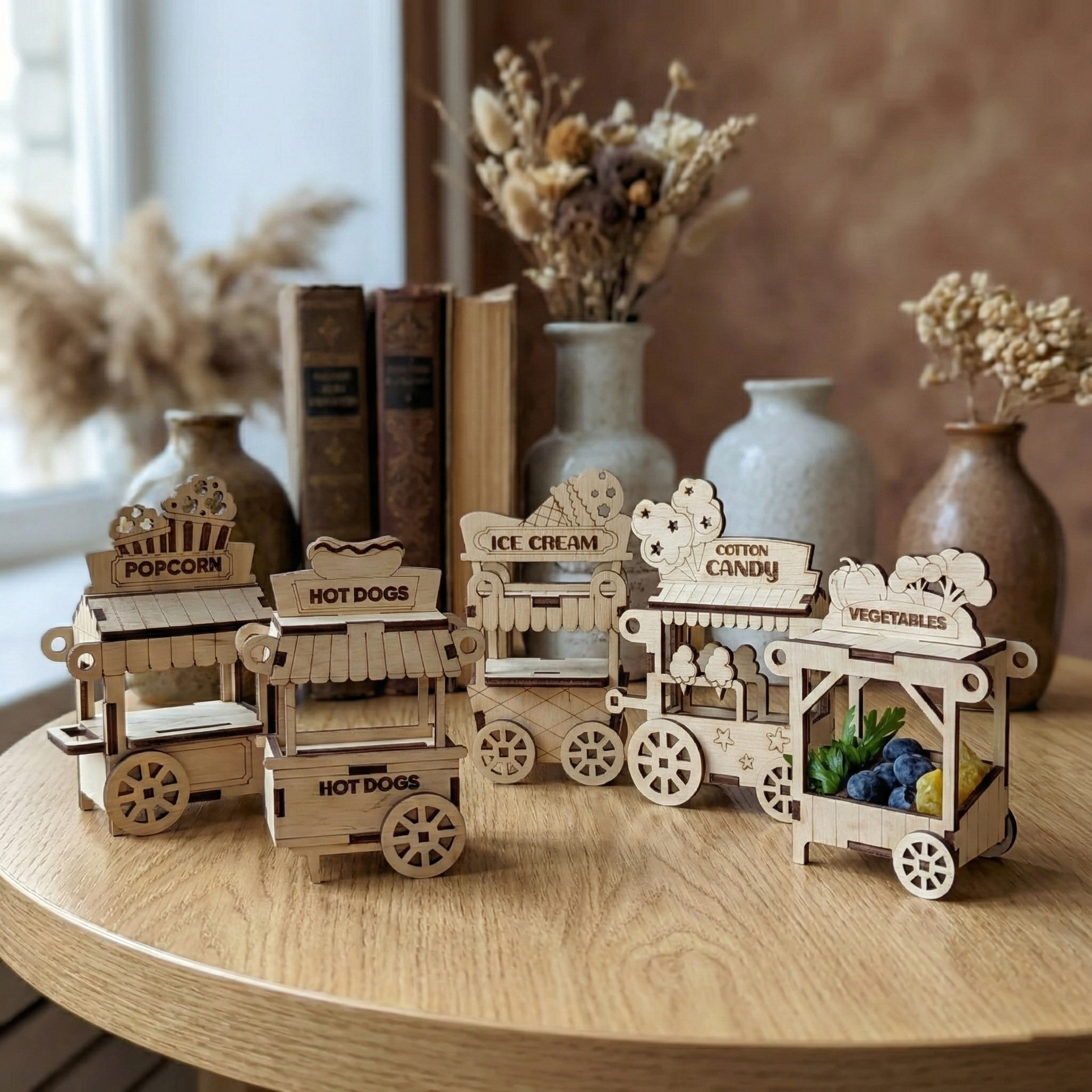 Wooden laser cut toy carts on a wooden table with decorative vases in the background