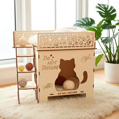 Laser cut wooden plywood two-story Cat Home (bunk bed style) with stairs leading to a sleeping platform and a lower hideaway. The light plywood structure features engraved cat silhouettes, fish bones, and paw prints on the railings and sides, with "Do Not Disturb" text. Displayed on a white fluffy rug with yarn balls, showing its function as a cozy pet gift.