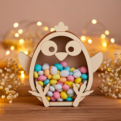 Laser cut plywood wooden chicken coin bank or candy box, filled with colorful pastel Easter chocolate eggs, sitting on a rustic table with soft, golden fairy lights and baby's breath flowers in the warm background.
