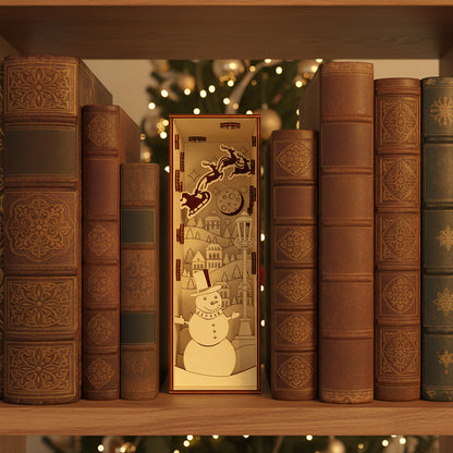 Intricate laser cut Christmas Book Nook with layered winter scene of a smiling snowman, flying reindeer and illuminated village rooftops, placed on a bookshelf against a cozy festive bokeh background.
