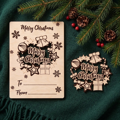Laser cut plywood greeting postcard with pop-out Christmas wreath ornament on green knit fabric with pine.