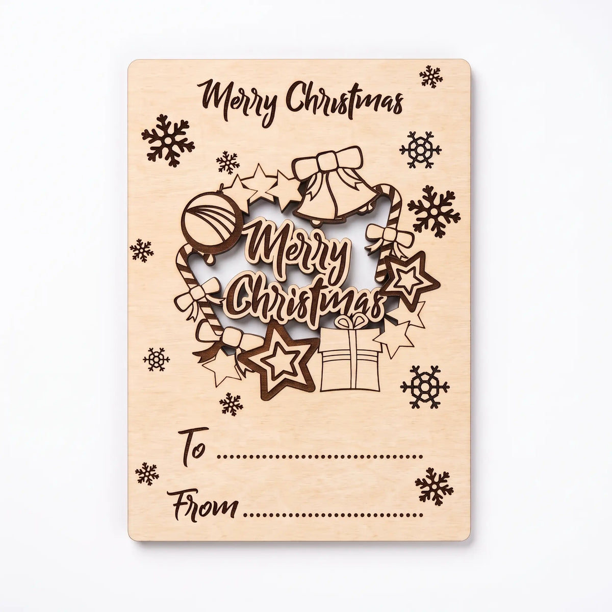 Direct top view of laser cut plywood holiday card with pop-out Merry Christmas wreath isolated on white.