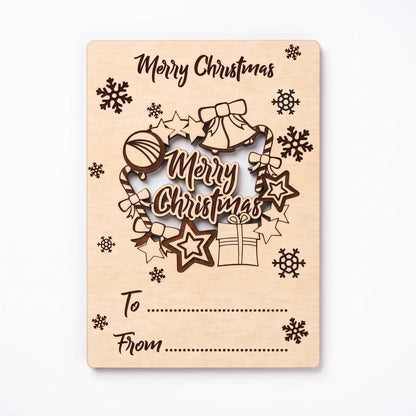 Direct top view of laser cut plywood holiday card with pop-out Merry Christmas wreath isolated on white.