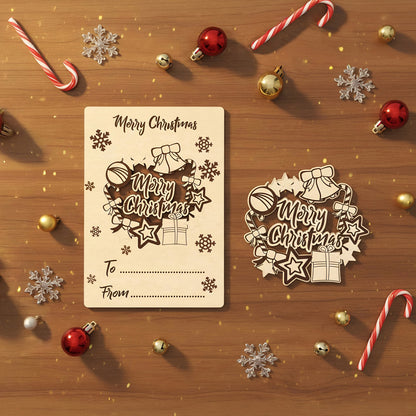 Delicate laser cut wooden Christmas card and tag set displaying elegant "Merry Christmas" lettering surrounded by festive bells, candy canes, presents and snowflakes, presented on a cozy wooden surface.