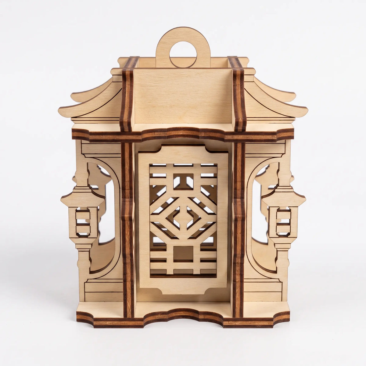 Front view of unfinished 3D laser cut plywood pagoda lantern featuring geometric fretwork windows on white background.